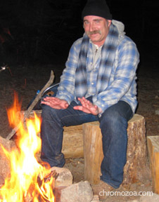 Photo of Robert at campfire